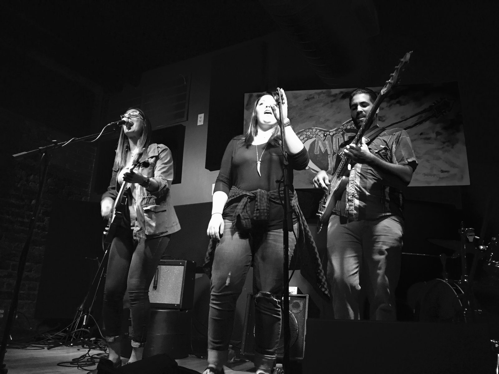 An independent band playing a small club, in black and white